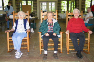 Rock’n’Roll: This photo (taken by Choctaw resident Joyce Hartmann at Mt. Eagle) was the inspiration for her painting. Rocking are (from left) Fairfield Bay residents Melva King, Dorothy Hendrickson and Ruby Krimm. In the background are (left) Sandra Ellis and Bonnie Hookman, all at Mt. Eagle.