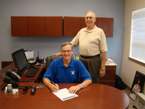 George Kelly, Chairman of Arkansas Alzheimers Awareness Walk, (R) witnesses the proclamation signing by Mayor Paul Wellenberger (L).